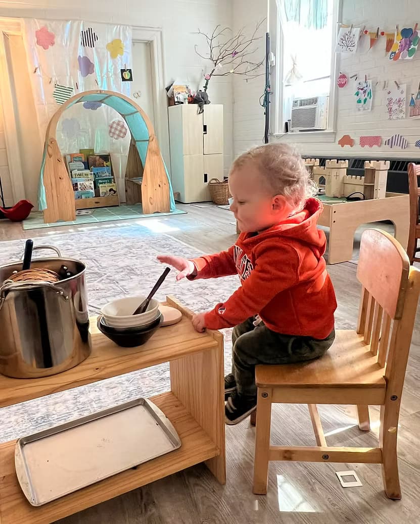 Children of mixed ages playing together in the classroom